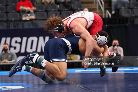 Aaron Brooks of Penn State wrestles Trent Hidlay of North Carolina State
