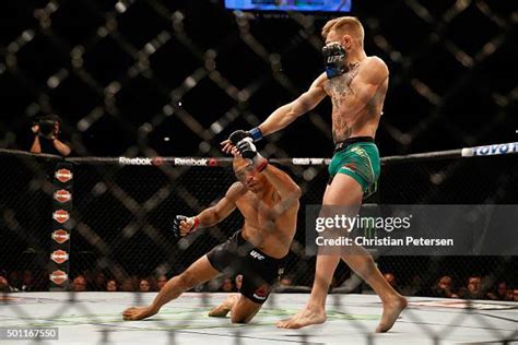 Conor McGregor punches Jose Aldo