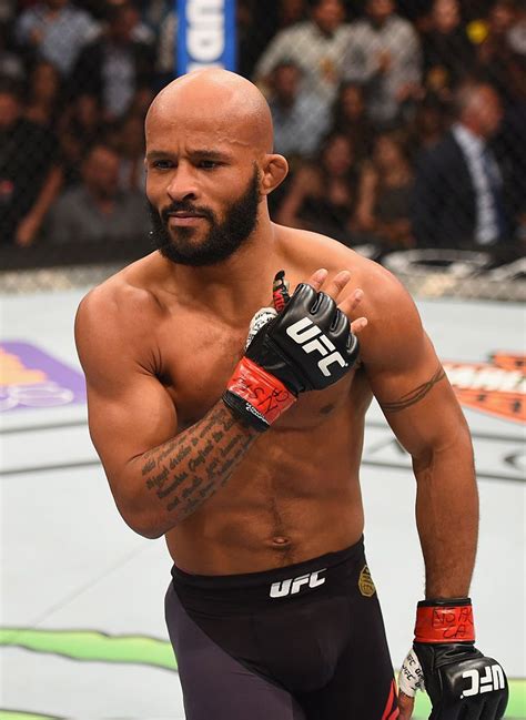 Demetrious Johnson celebrates victory