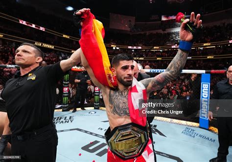 Ilia Topuria celebrates his championship victory against Alexander Volkanovski