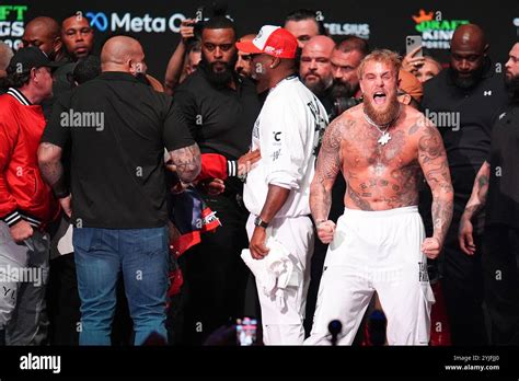 Jake Paul reacts after being slapped by Mike Tyson