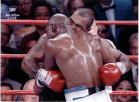 Mike Tyson biting Evander Holyfield