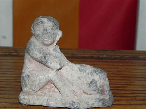 Painted limestone figure of wrestlers