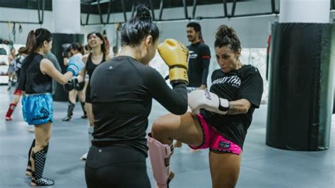 Women discussing Muay Thai training